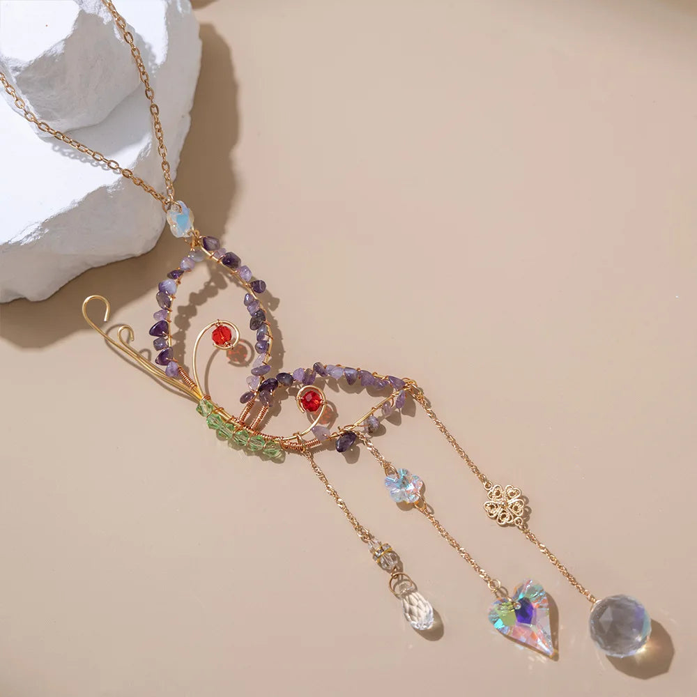 Delicate gold necklace with multicolored gemstones on a beige background boho home decor, crystal wind chime, sun catcher for windows, moon prism chime, agate stone hanging, garden art decor, patio hanging decoration, boho housewarming gift, spiritual gift, crystal suncatcher, balcony decor, meditation decor, handmade crystal chime