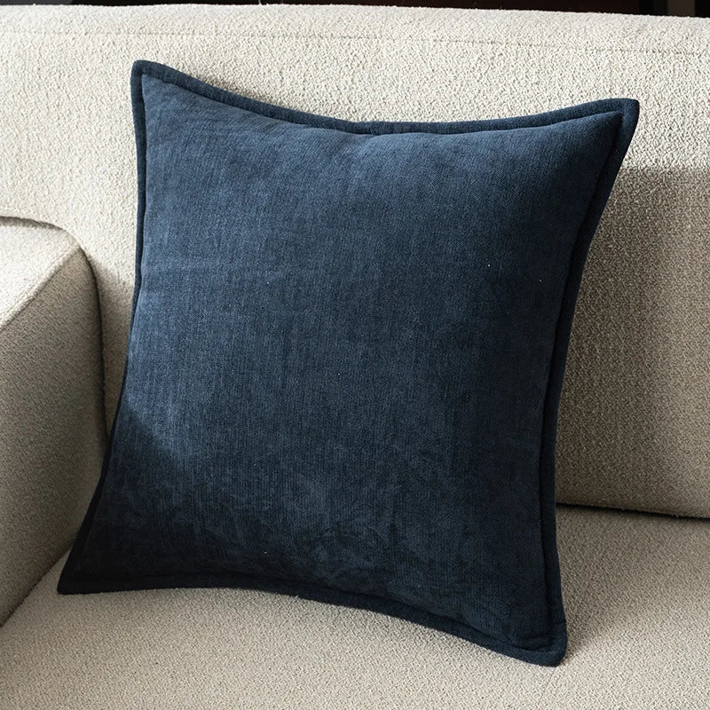 Blue pillow on a beige sofa