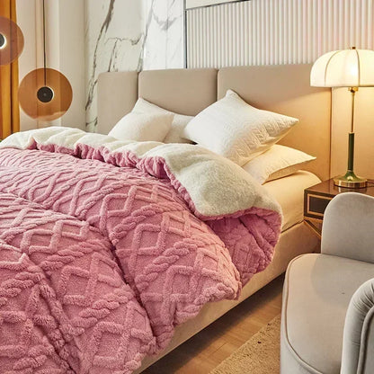 Pink textured blanket on a bed in a cozy bedroom setting with a lamp and nightstand. Soft plush duvet cover and blanket in solid color with striped jacquard design, dual-use artificial cashmere fleece bedding for cozy winter warmth