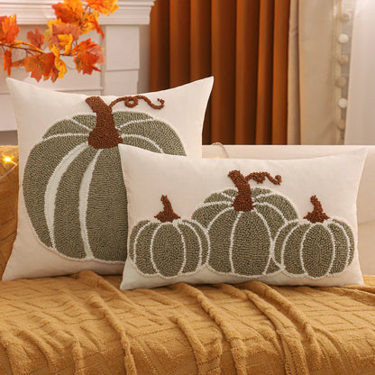 Decorative pillows with pumpkin patterns on a couch. Festive fall pillow cover for Halloween and Thanksgiving décor
