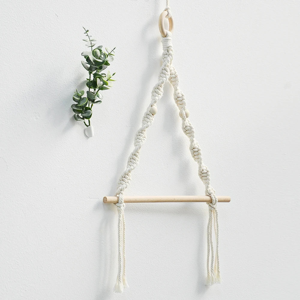 Macrame plant hanger with wooden rod on a white background boho home decor, toilet paper holder, bohemian bathroom accessory, tissue holder, wall-mounted towel rack, cotton rope toilet paper rack, wooden bead towel holder, rustic home decor, boho wall decor, bathroom organization, housewarming gift