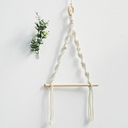 Macrame plant hanger with wooden rod on a white background boho home decor, toilet paper holder, bohemian bathroom accessory, tissue holder, wall-mounted towel rack, cotton rope toilet paper rack, wooden bead towel holder, rustic home decor, boho wall decor, bathroom organization, housewarming gift
