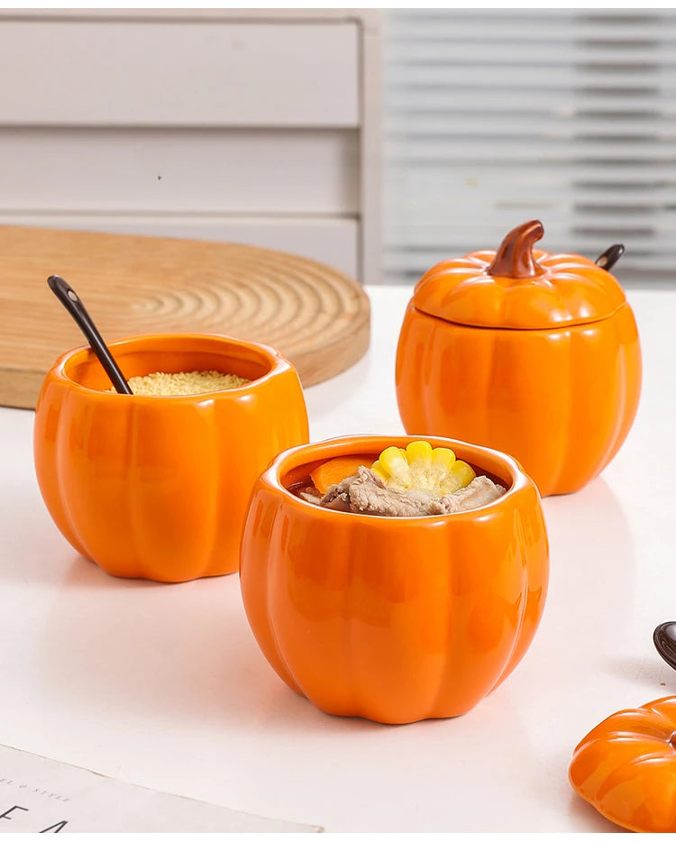 Set of three pumpkin-shaped ceramic containers with lids on a light surface. Pumpkin-shaped ceramic bowl with lid kitchen container Halloween and Thanksgiving fall serving dish