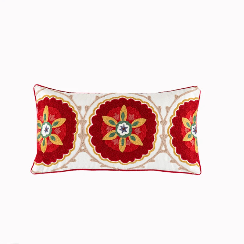 Decorative pillow with red and gold floral patterns on a white background. Bohemian embroidered throw pillow cover with geometric design, cotton-blend cushion for sofa, bed, or modern home decor.