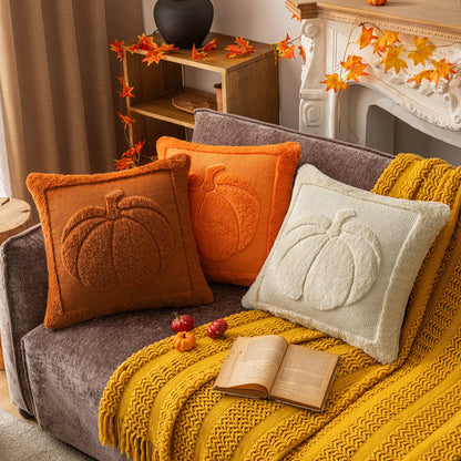 Cozy living room with a sofa adorned with pumpkin-themed pillows and a yellow blanket. Halloween pumpkin plush pillow cover for sofa and bed decor.