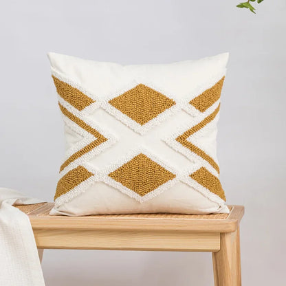 Decorative pillow with geometric pattern on a wooden bench against a light gray background Nordic blue tufted cushion cover with geometric stripe and grid crochet pattern, tassel pillow cover for sofa, bed, and boho home decor