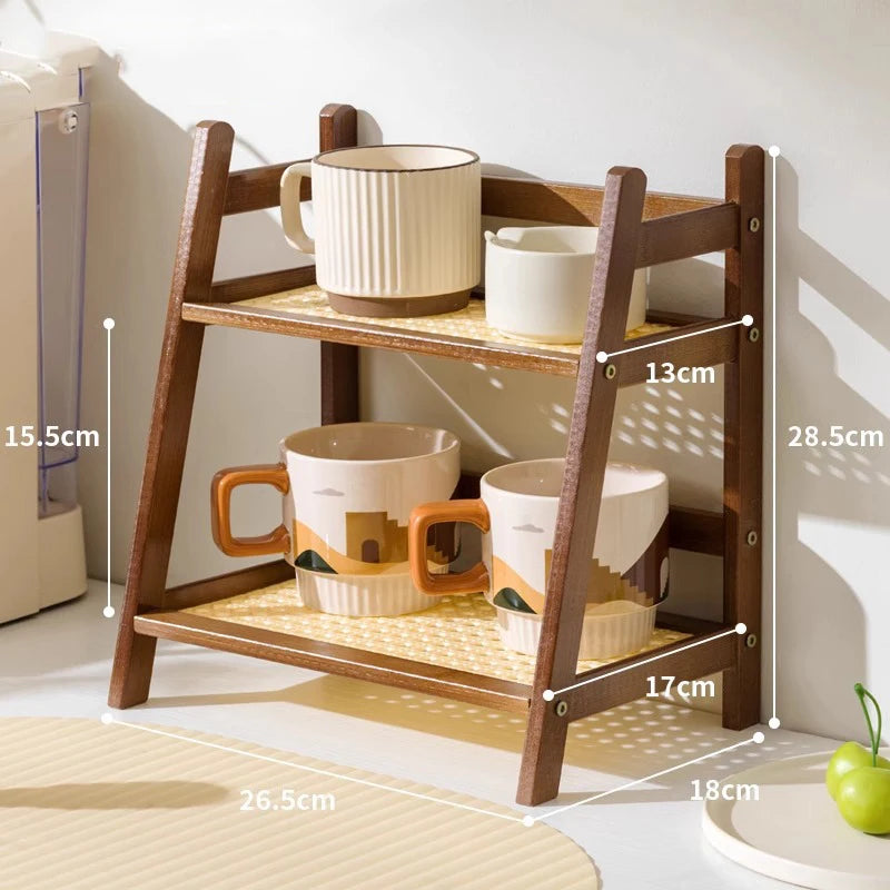 Wooden shelf with ceramic cups and bowls, showing dimensions. 2-tier bamboo countertop organizer shelf in walnut and blonde finish, multipurpose coffee cup holder and storage rack for kitchen, bathroom, or vanity
