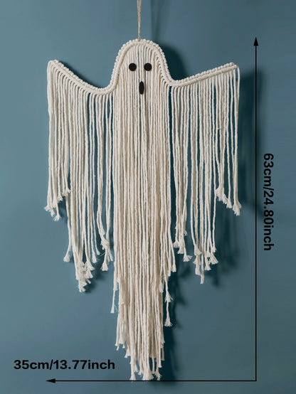 A ghost-shaped macrame wall hanging made from off-white cotton cord, shown against a muted blue-gray background with black dimension arrows and text indicating 63cm height and 35cm width from My Boho Home