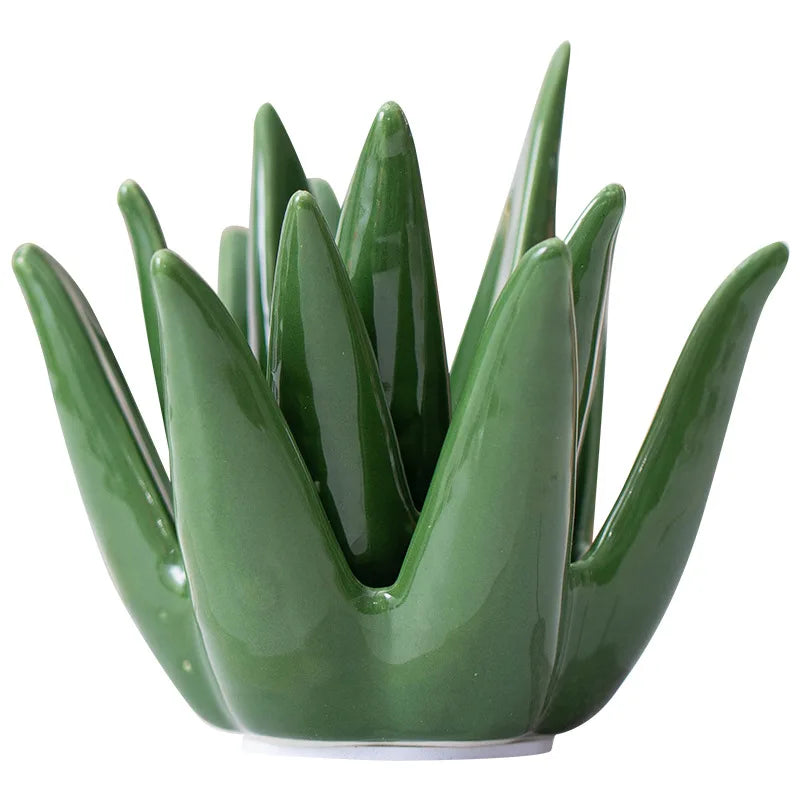 Green ceramic aloe vera plant on a white background. Green ceramic cactus jewelry storage dish for home decor