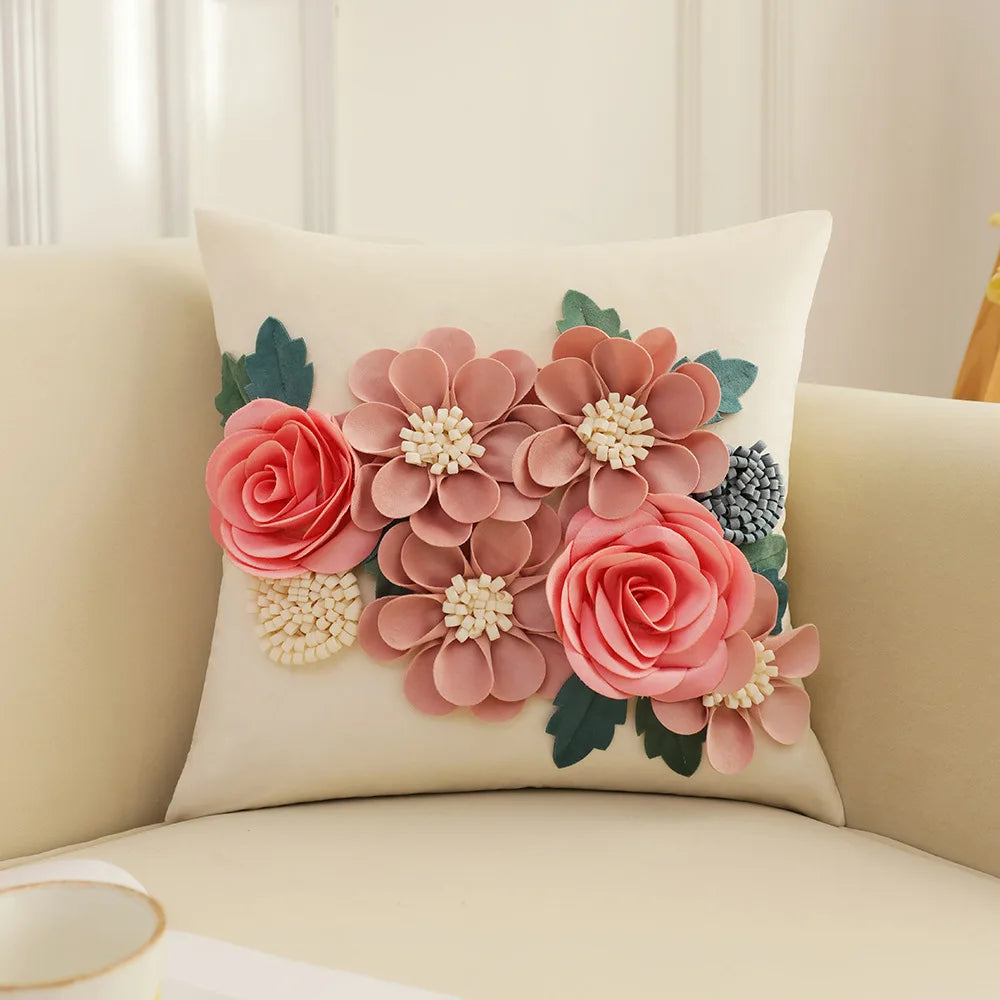 Decorative pillow with floral design on a beige couch. Handmade patchwork floral pillowcase for bed or living room