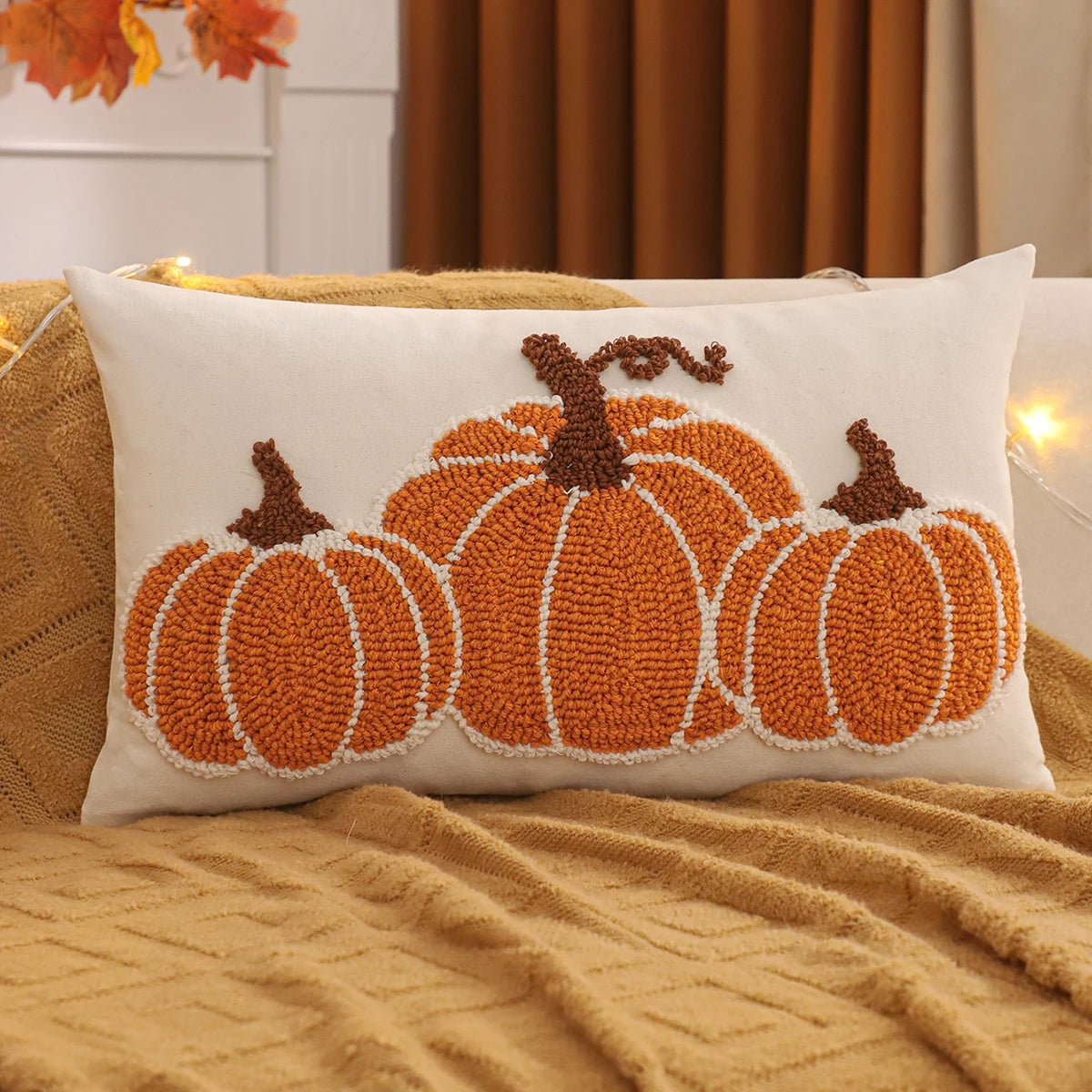 Decorative pillow with pumpkin design on a couch. Orange pumpkin embroidery pillowcase 18x18 inch