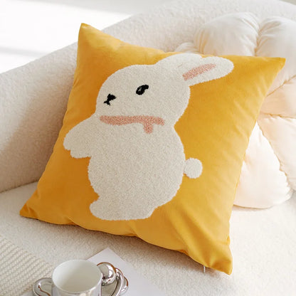 Yellow pillow with a bunny design on a white couch Nordic lily embroidered throw pillow cover in flannel fabric, floral square cushion case for sofa, bed, and boho home decor
