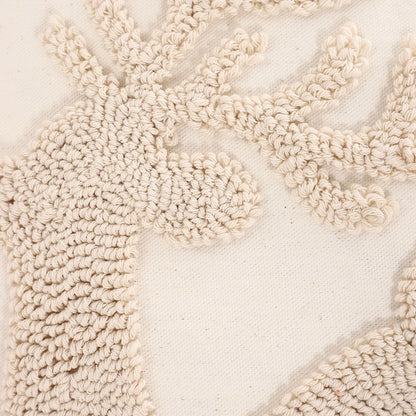 Close-up of a textured beige rug with a subtle pattern. Christmas embroidered pillow cover with tufted snowflake and reindeer design in 18x18 inches, festive canvas cushion case for sofa or bed