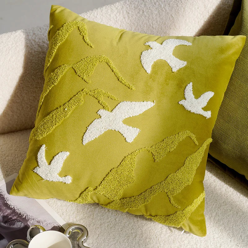 Green pillow with white leaf patterns on a beige surface boho home decor, housewarming gift, embroidered pillow cover, flying bird cushion, animal pattern pillowcase, decorative throw pillow, Nordic cushion cover, luxury boho accent, sofa decor, nature-inspired pillow, canvas cushion case, textured home accessories