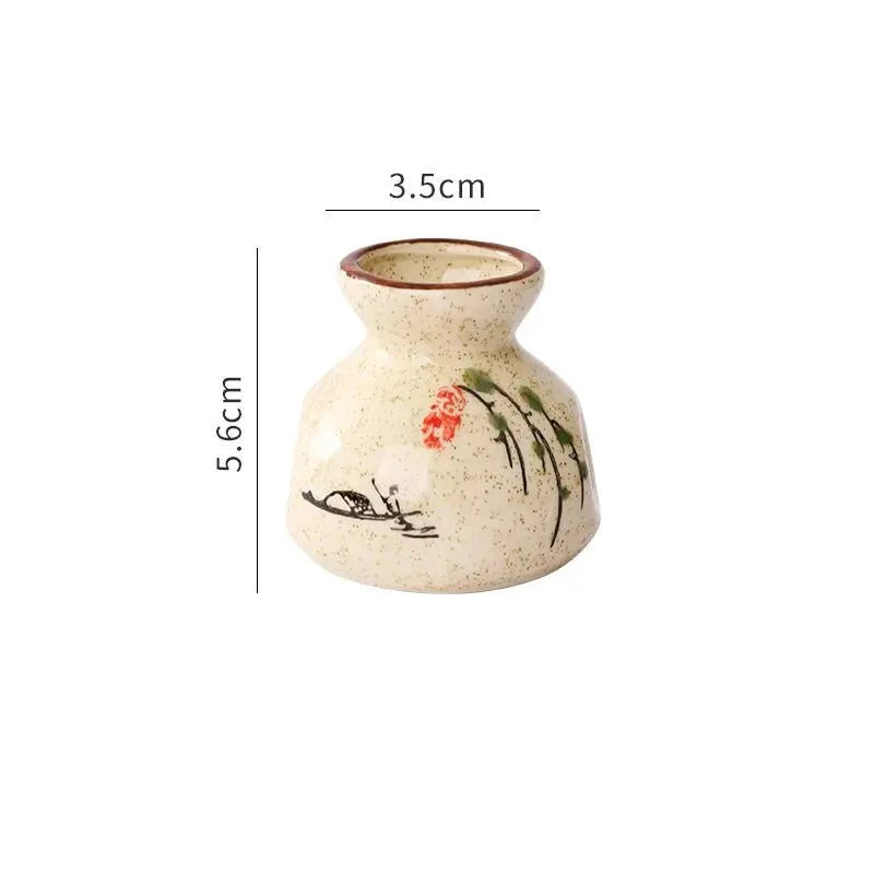 Small ceramic vase with floral design and measurements on a white background