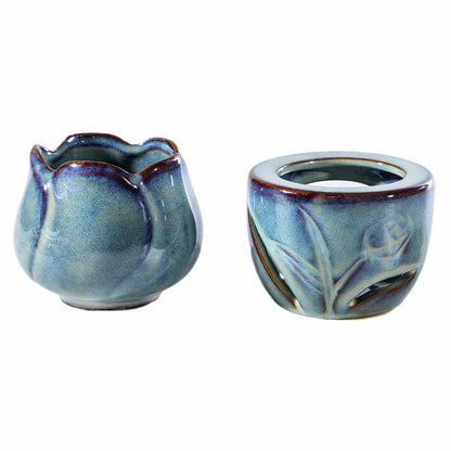 Two ceramic containers with floral designs on a white background. tulip ceramic essential oil incense burner, candle-powered aroma diffuser for home fragrance and calming boho home décor