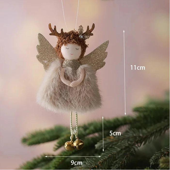 Decorative angel ornament with antlers hanging on a tree branch, with measurements indicated.
