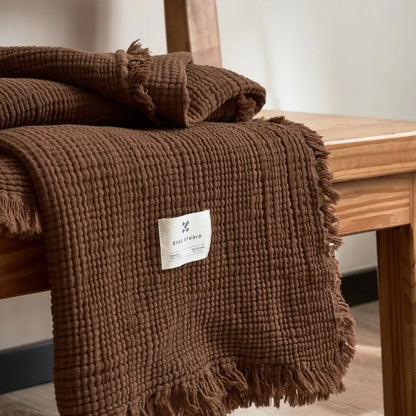 Brown Maillard cotton gauze blanket with tassels, four-layer muslin throw for sofa, bed, and boho home decor