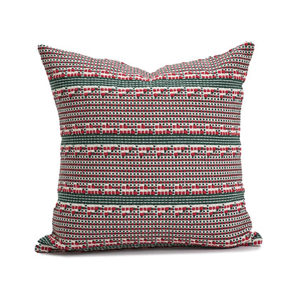 Decorative pillow with a red and green pattern on a white background