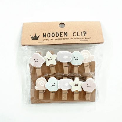 Packaged wooden clips with cloud designs on a white background