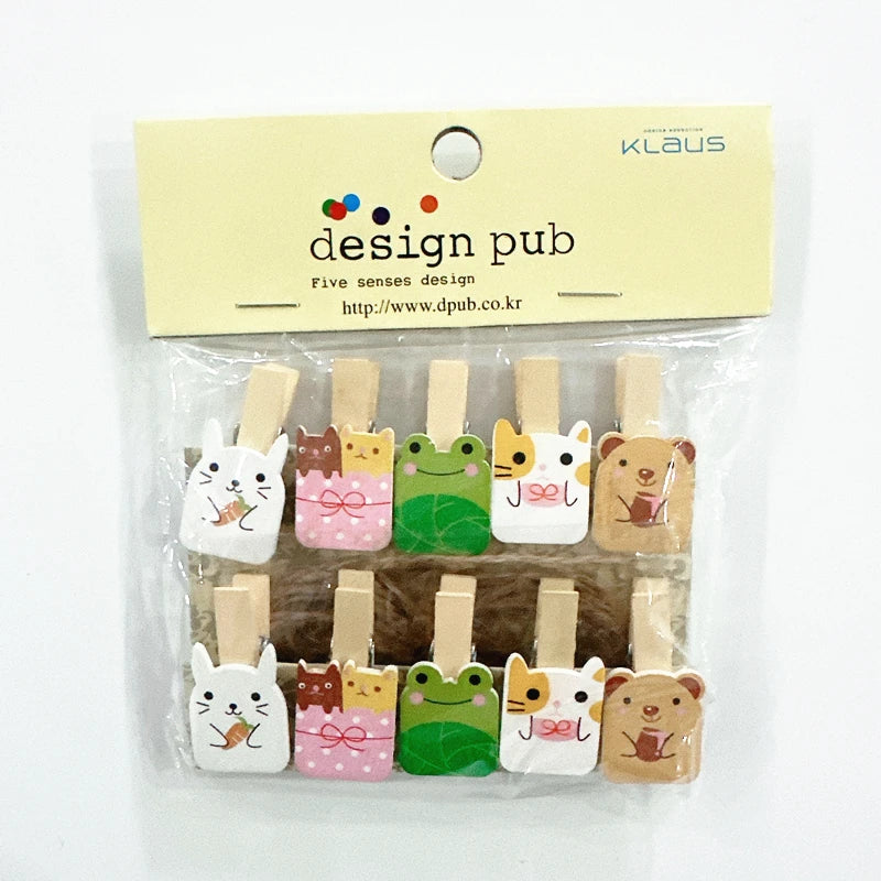 Set of cute animal-shaped wooden clips in packaging with 'design pub' branding.