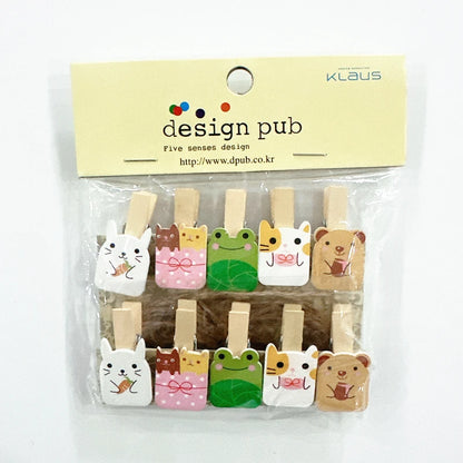 Set of cute animal-shaped wooden clips in packaging with 'design pub' branding.