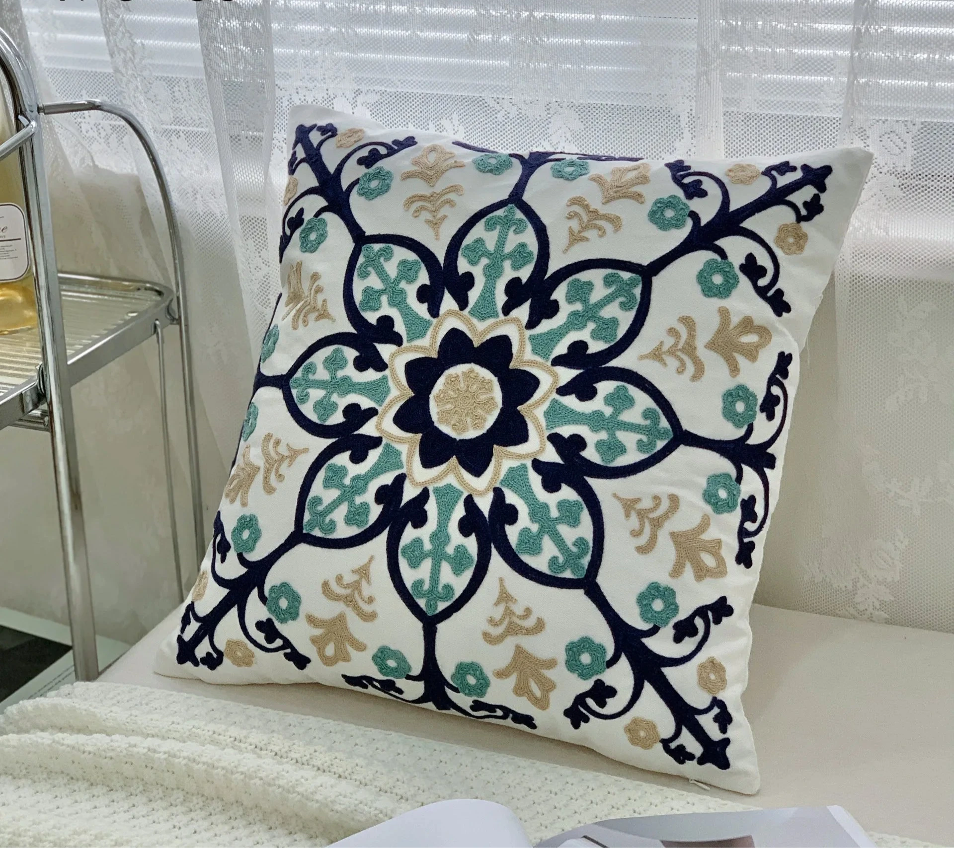 Decorative pillow with floral pattern on a couch, floral embroidery on linen cotton cushion cover – boho home decor accent