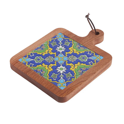 Wooden cutting board with a colorful geometric pattern on a white background