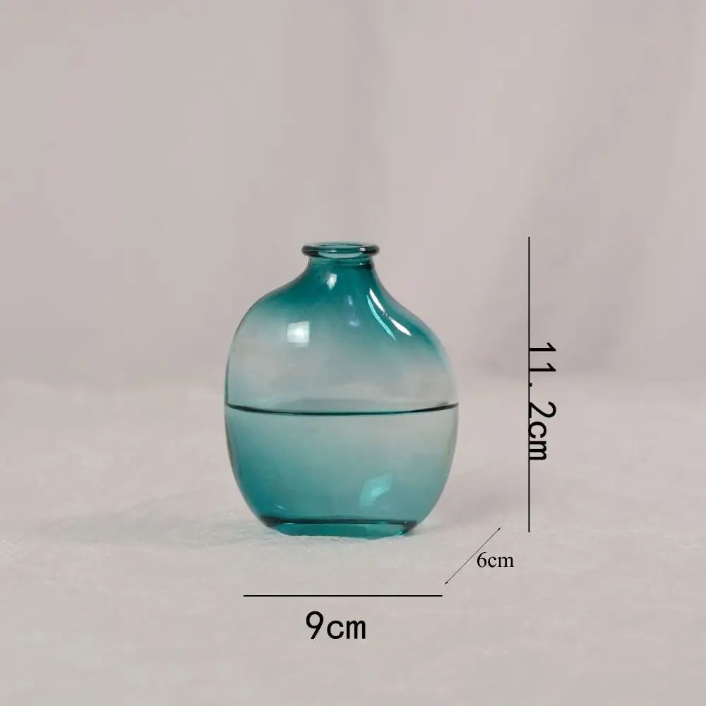 Blue glass vase with measurements on a light gray background
