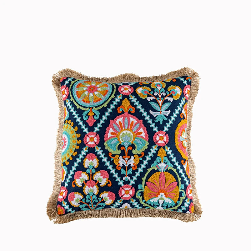 Decorative pillow with colorful floral pattern on a white background. Bohemian embroidered throw pillow cover with geometric design, cotton-blend cushion for sofa, bed, or modern home decor.
