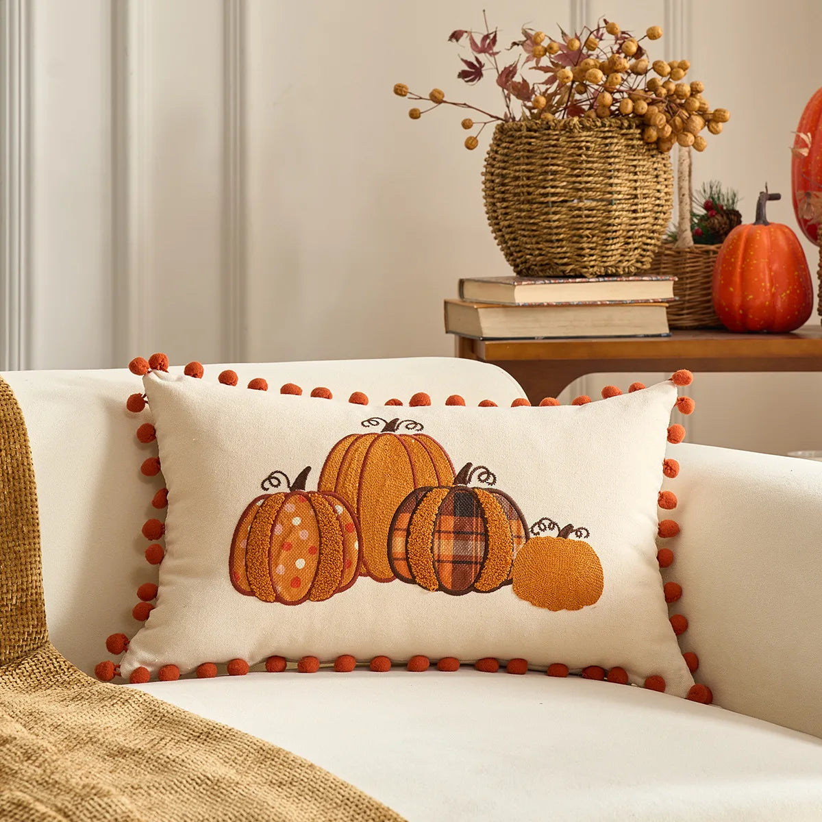 Decorative pillow with pumpkins on a couch, surrounded by autumn-themed decor. Halloween and Thanksgiving decorative pillow cover For Fall