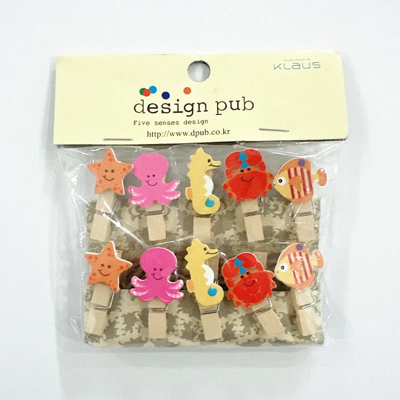 Packaged set of colorful sea-themed paper clips with 'Klaus' branding.
