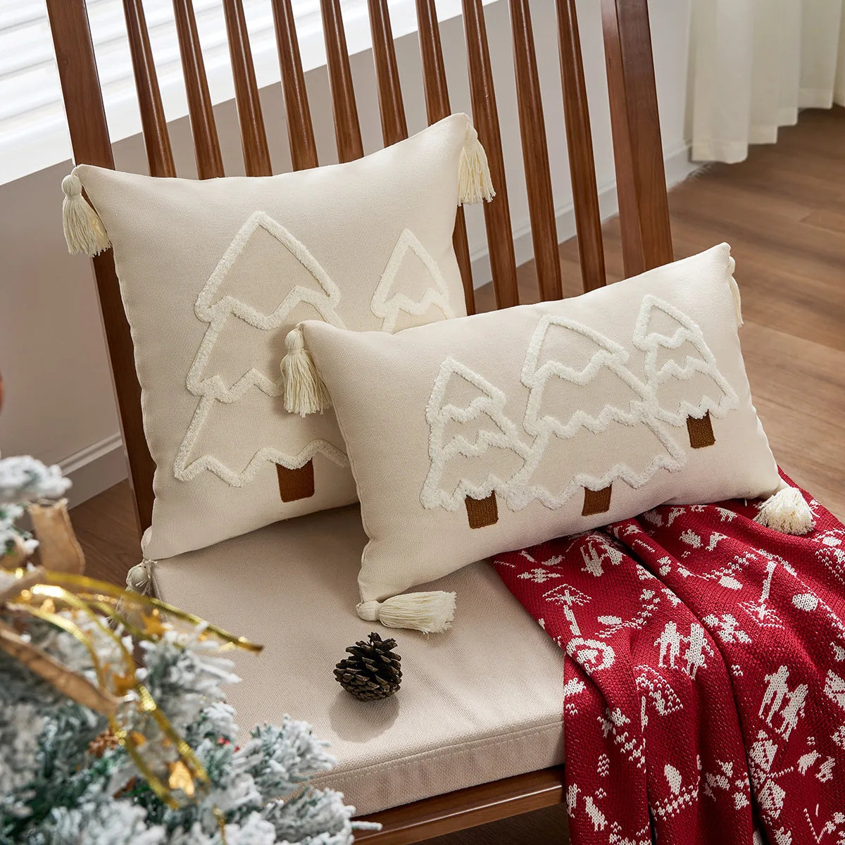 Decorative pillows with tree patterns on a wooden chair, surrounded by Christmas decor. tufted Christmas pillow cover with tassels, decorative festive cushion case for sofa or bed in 12x20 or 18x18 inches