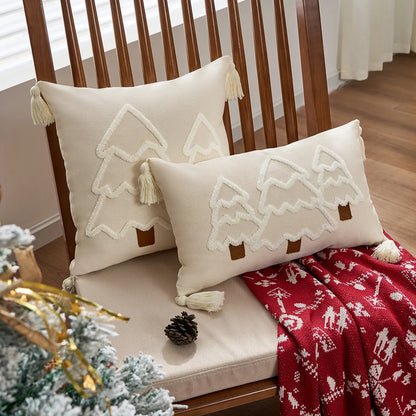 Decorative pillows with tree patterns on a wooden chair, surrounded by Christmas decor. tufted Christmas pillow cover with tassels, decorative festive cushion case for sofa or bed in 12x20 or 18x18 inches