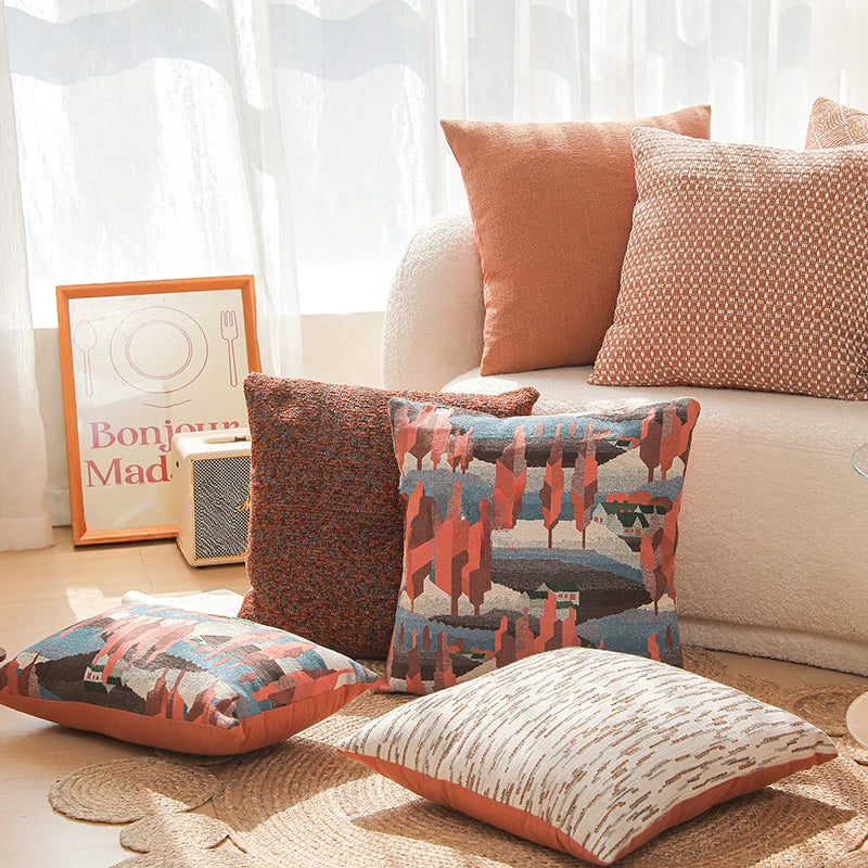 Decorative pillows on a sofa with a 'Bonjour Mademoiselle' sign in the background. Modern yarn-dyed throw pillow cover, luxury textured decorative cushion for sofa, bed, or window seating in soft neutral tones.