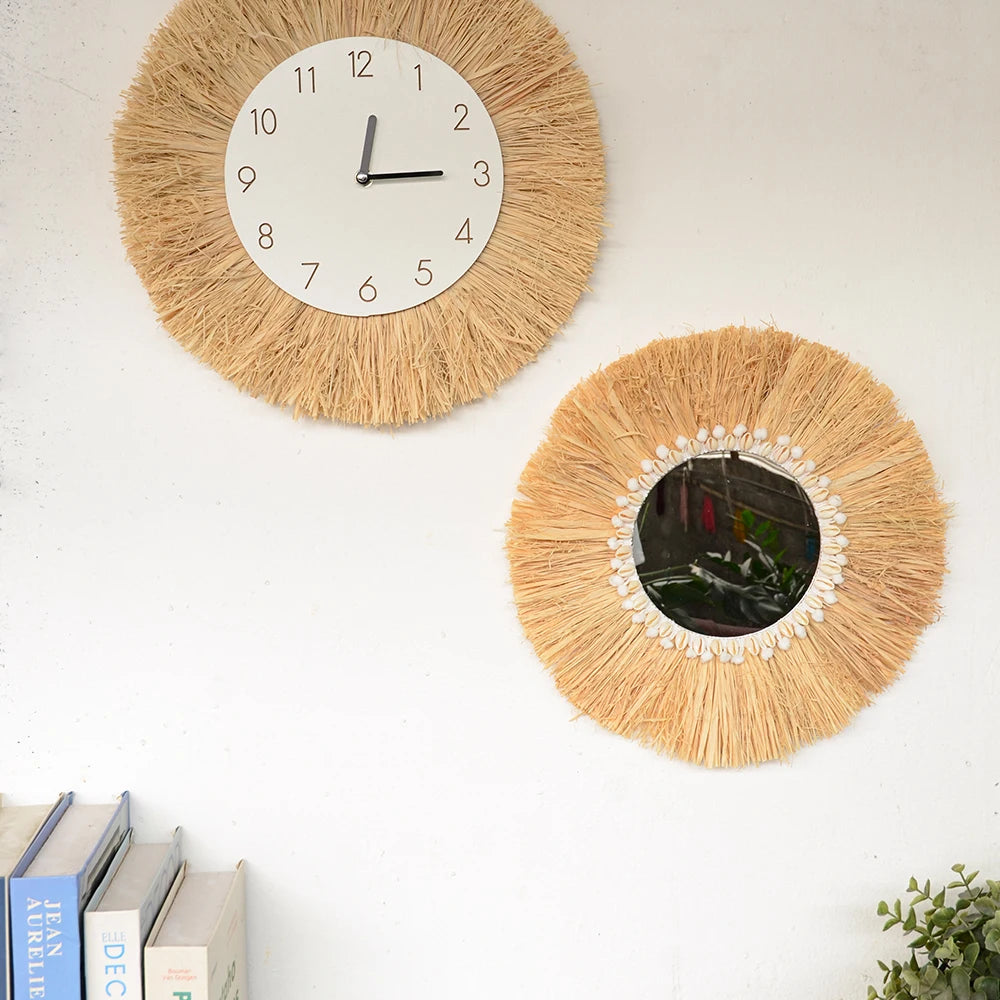 Two round wall decor items on a white wall, one with a clock face and the other with a mirror. boho home decor, boho wall mirror, macrame wall mirror, nordic decor, romantic wedding wall decoration, housewarming gift, round straw mirror, woven wall decor, tapestry mirror, boho bedroom wall accent, rustic mirror wall hanging