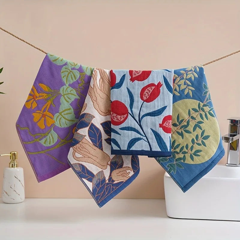 Colorful tea towels with floral and abstract designs hanging over a sink.