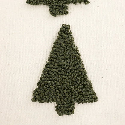 Green knitted tree-shaped ornament on a white background. Christmas Boho Home Decor embroidered pillow cover with tufted snowflake and reindeer design in 18x18 inches, festive canvas cushion case for sofa or bed