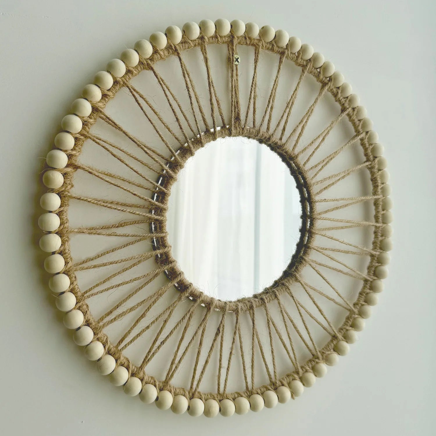 Round mirror with wooden bead and string design on a light gray background Hand-woven Nordic round decorative mirror with Lafite grass frame and hemp rope, boho wall hanging for living room, entryway, or bedroom decor