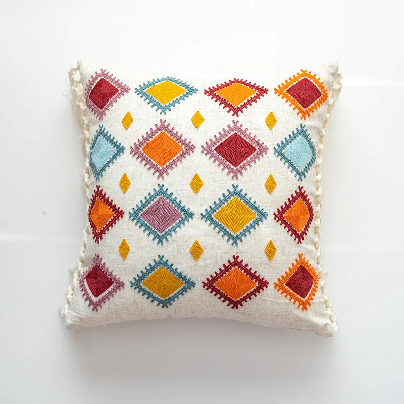 Decorative pillow with colorful geometric pattern on a white background