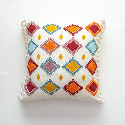 Decorative pillow with colorful geometric pattern on a white background