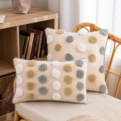 Decorative pillows with pom-pom patterns on a chair next to a bookshelf. Boho cushion cover for sofa, bed, or chair 18x18 inch
