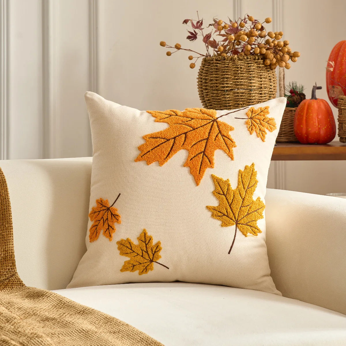 Decorative pillow with autumn leaf patterns on a couch. Halloween and Thanksgiving decorative pillow cover For Fall