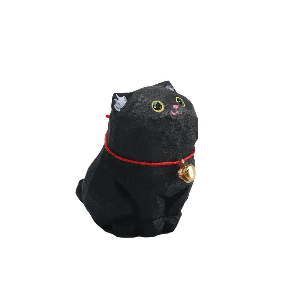 Black cat-shaped plush toy with a red collar and gold bell on a white background
