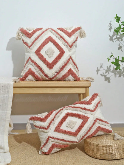 Decorative pillows with geometric patterns on a wooden stool and floor. Nordic Moroccan tufted throw pillow cover in geometric jacquard design, boho accent cushion for sofa, bed, or car, available in 12x20 inch lumbar and 18x18 inch square sizes – cozy textured boho home decor.