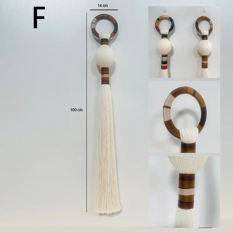 Decorative keychain with tassel and wooden ring on a white background. boho macrame wall art