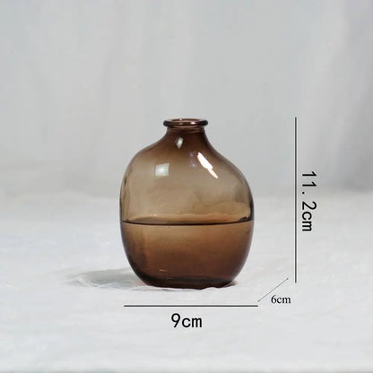 Brown glass vase with measurements on a light gray background