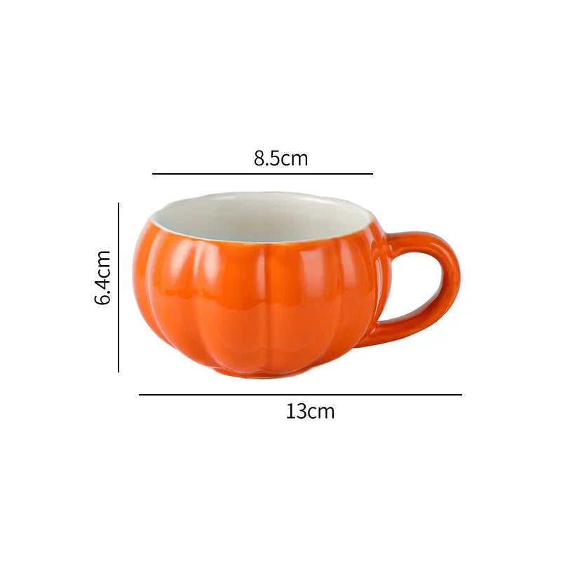 Orange pumpkin-shaped mug with measurements on a white background. Pumpkin ceramic mug with spoon Halloween autumn fall coffee cup