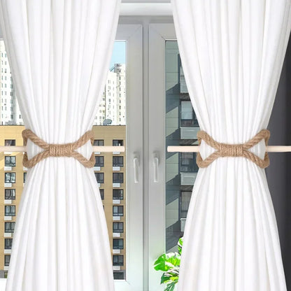 White curtains with burlap tiebacks in front of a window with cityscape view. boho home decor, curtain tie back, wooden curtain buckle, nordic home accessory, hemp rope curtain tie, rustic window decor, boho curtain accessory, modern farmhouse, minimalist curtain hold, housewarming gift idea