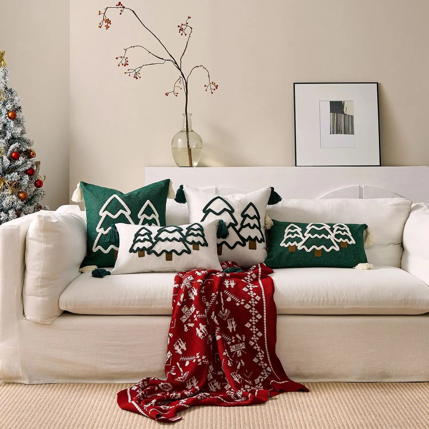 White sofa with decorative pillows and a red blanket in a living room setting. tufted Christmas pillow cover with tassels, decorative festive cushion case for sofa or bed in 12x20 or 18x18 inches.